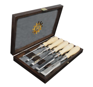 Set of 5 chisels with differing blade width and length with handles made from ash hardwood.  Set is in presentation box